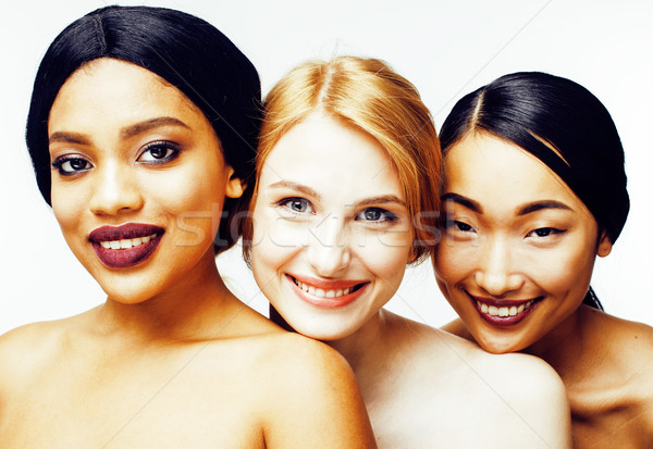 three different nation woman: asian, african-american, caucasian together isolated on white backgrou Stock photo © iordani