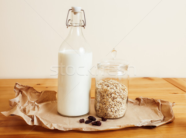real comfort wooden kitchen with breakfast ingredients close up in glass, honey, oatmeal, milk, mues Stock photo © iordani
