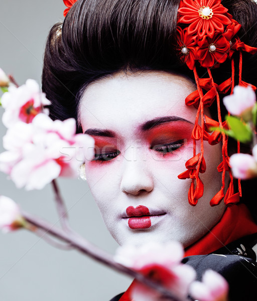 Fiatal csinos gésa fekete kimonó sakura Stock fotó © iordani
