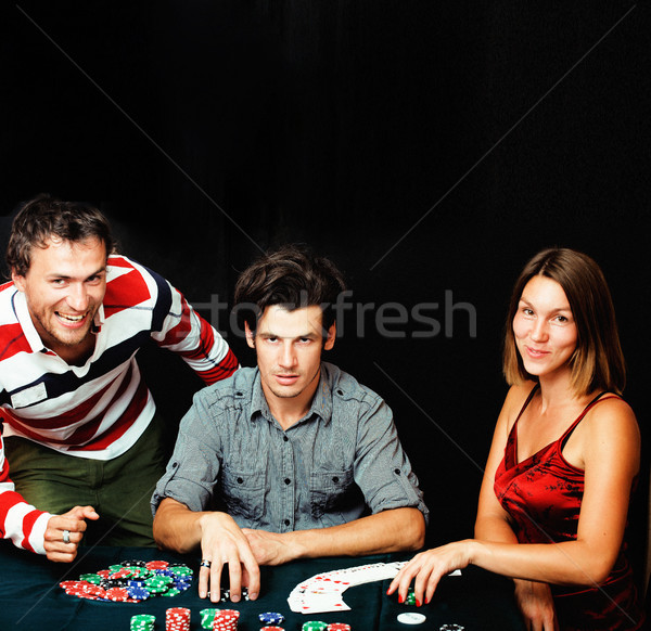 Сток-фото: молодые · люди · играет · покер · черный · моде · фитнес
