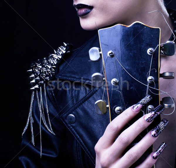 Stock photo: Fashion Rocker Style Model Girl Portrait. Hairstyle. Punk Woman Makeup, Hairdo and black Nails. Smok