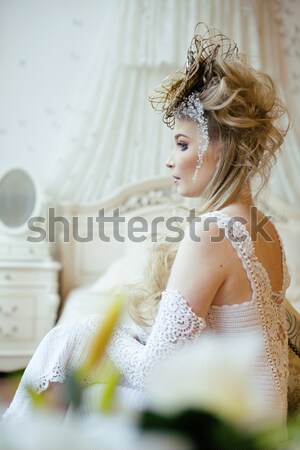 beauty young bride alone in luxury vintage interior with a lot o Stock photo © iordani