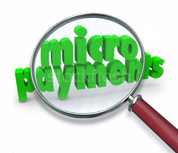 Micropayments Word Magnifying Glass Searching Tiny Money Amount Stock photo © iqoncept