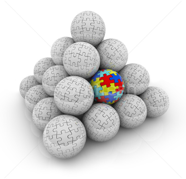 Puzzle Pieces Pyramid Balls One Unique Special Autistic Standing Stock photo © iqoncept