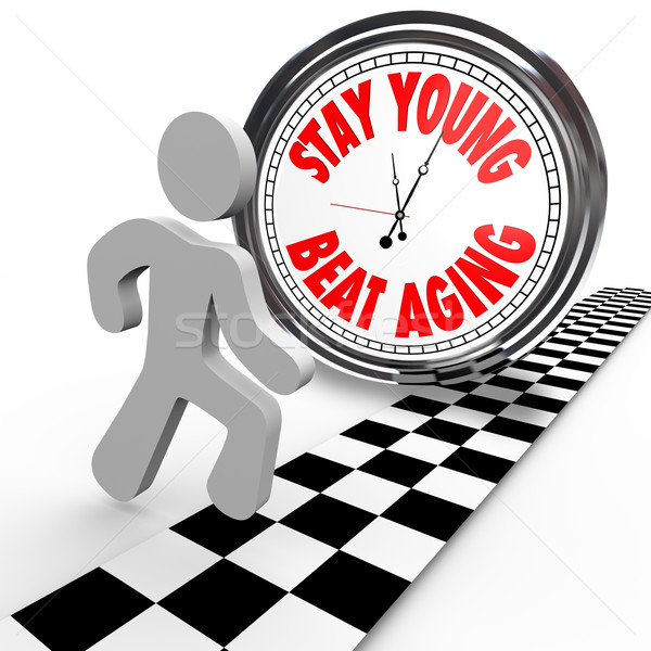 Stay Young Beat Aging Race Against Time Clock Stock photo © iqoncept