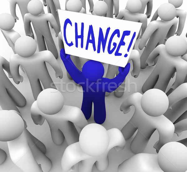 Stock photo: Change - Person Holding Sign in Crowd