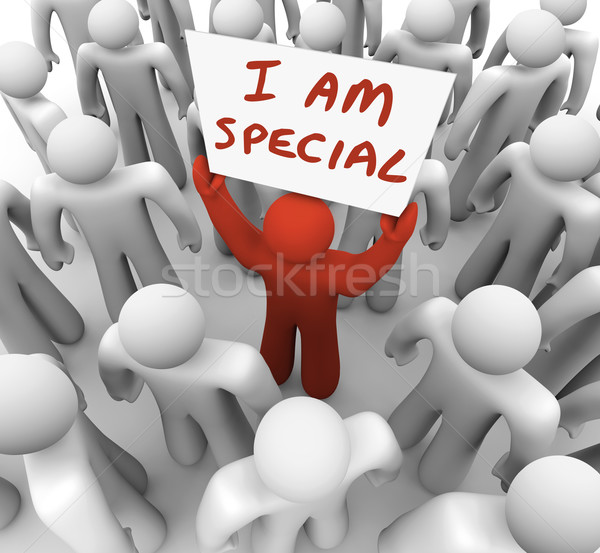 Stock photo: I Am Special Man Holding Sign Standing Out Crowd Different Uniqu
