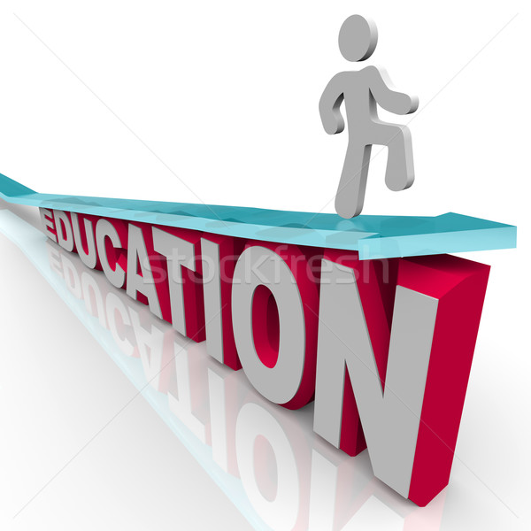 Education - Man Rides Arrow Over Word Stock photo © iqoncept
