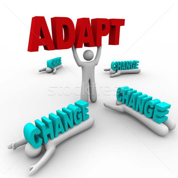 Stock photo: One Stands Holding Word Adapt, Others Crushed