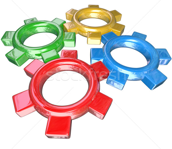 Four Colorful Gears Turning Together in Unison - Teamwork Synerg Stock photo © iqoncept