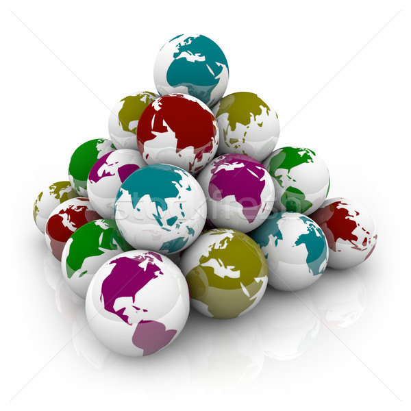 Pyramid of Colorful Planet Earths Stock photo © iqoncept