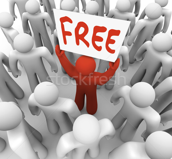 Stock photo: Free Sign Man Holding Giveaway Banner in Crowd 