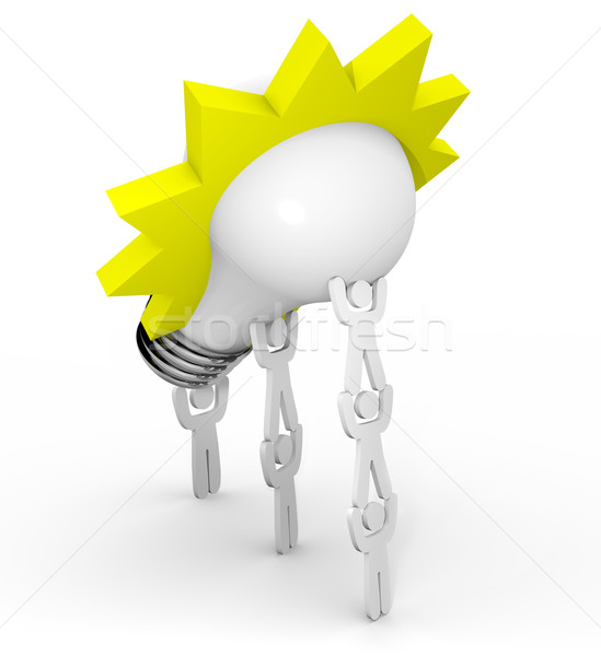 Innovation - Team Lifting Light Bulb Stock photo © iqoncept