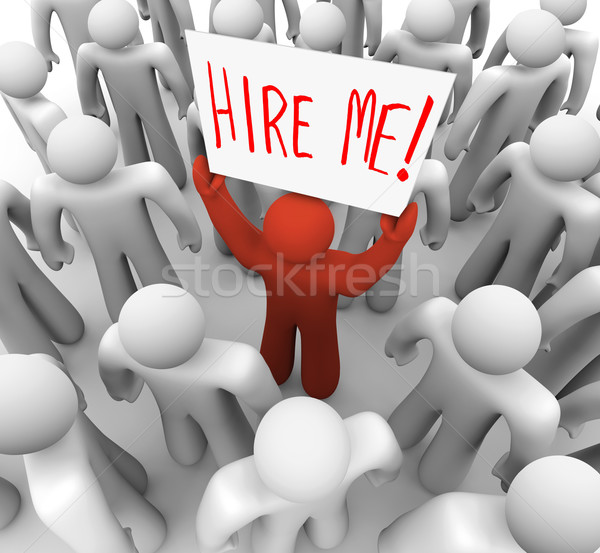 Stock photo: Person Holding Hire Me Sign in Crowd