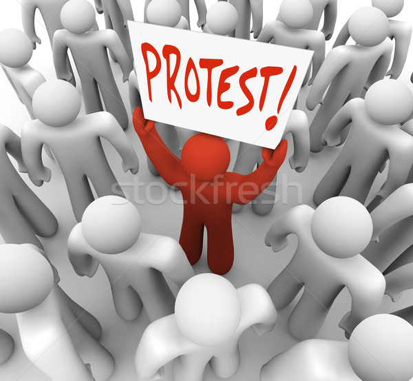 Stock photo: Demonstration Man Holds Protest Sign Movement for Change