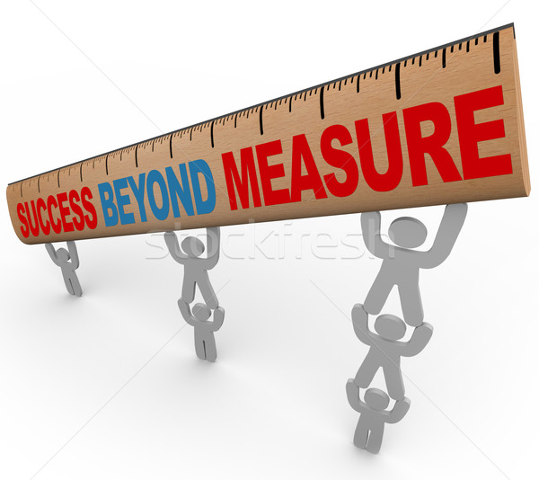 Success Beyond Measure - Team Lifting Ruler Stock photo © iqoncept