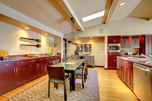 Luxury modern dining room with mahogany kitchen. Stock photo © iriana88w
