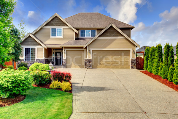 Siding house with stone trim and tile roof Stock photo © iriana88w