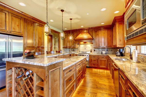 Stock photo: Luxury wood kitchen with granite countertop. 