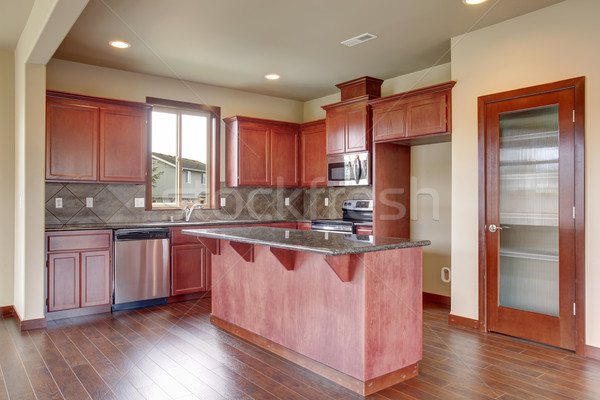 Stock photo: Traditional kitchen with dark hardwood floor.