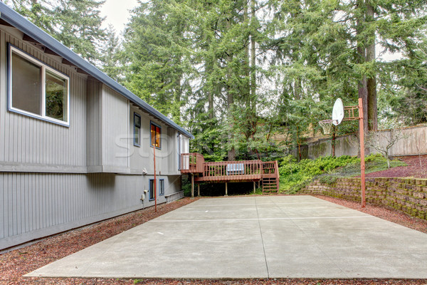 Back of the grey house with basket ball play area. Stock photo © iriana88w