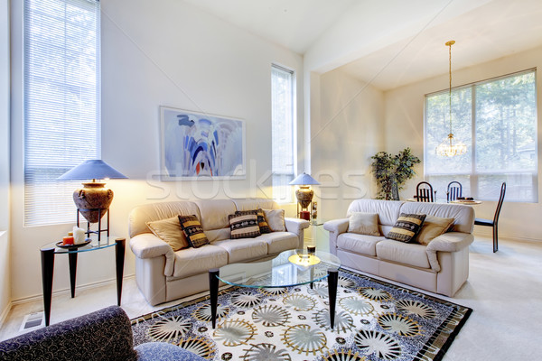 Bright white and blue living room with glass coffee table Stock photo © iriana88w