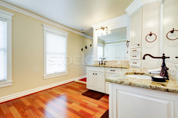 Luxury large white master bathroom with cherry hardwood. Stock photo © iriana88w