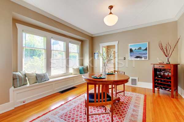 Elegant dining room with window bench with cherry hardwood floor. Stock photo © iriana88w