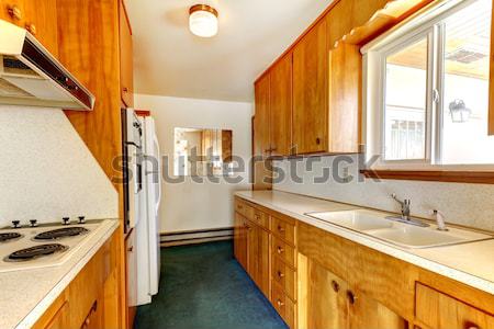 Large bathroom with cherry cabinets and granite countertop. Stock photo © iriana88w