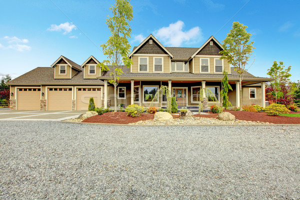 Large farm country house with gravel driveway and green landscape. Stock photo © iriana88w