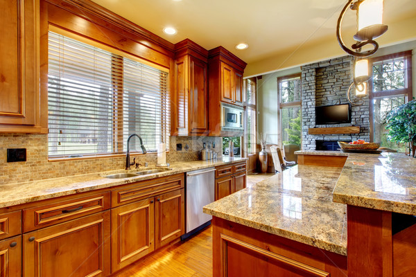 Stock photo: Luxury wood kitchen with granite countertop. 