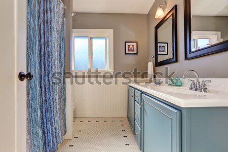 Stock photo: Small laundry room with periwinkle walls.