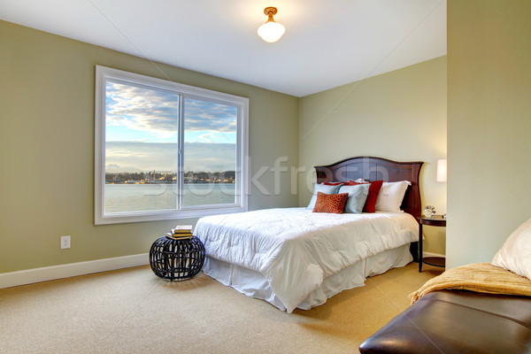 Green large bedroom with white bed and water view. Stock photo © iriana88w