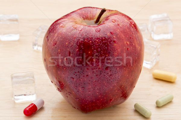 Colorful pills and red apple Stock photo © ironstealth