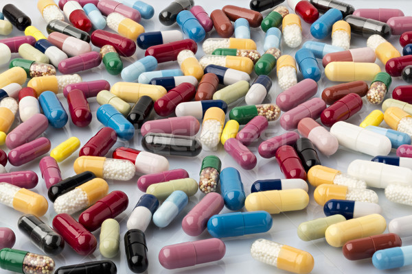 Set of various colorful medical capsules Stock photo © ironstealth