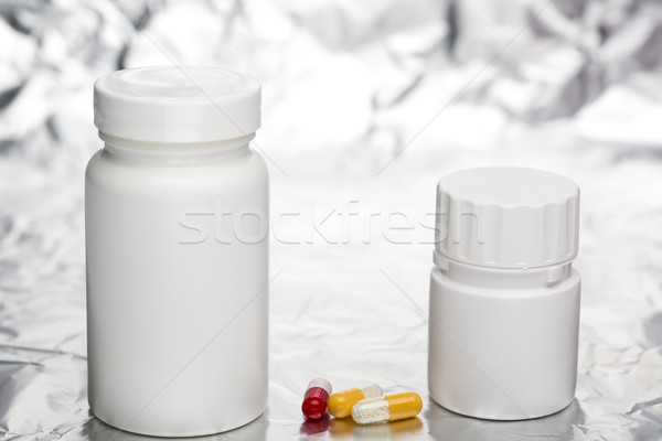 Medical capsules with white plastic bottle Stock photo © ironstealth