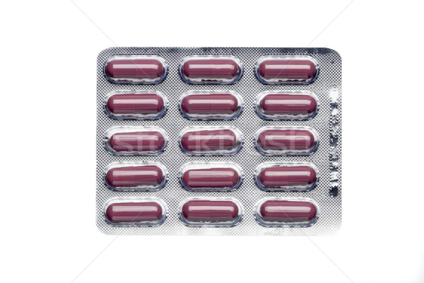 Brown capsules in a blister pack isolated on white background Stock photo © ironstealth
