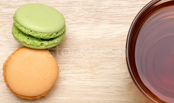 Macaroons and glass cup of black tea Stock photo © ironstealth