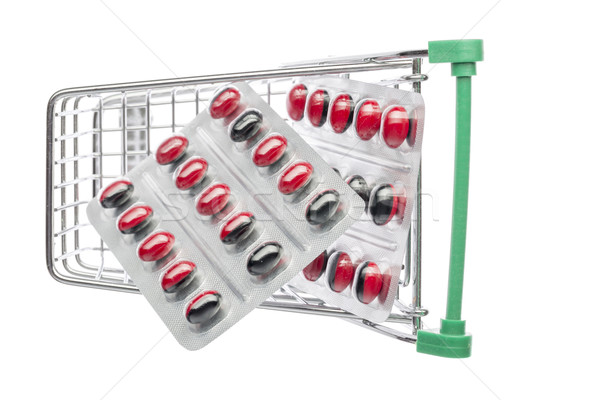 Shop cart with red-black pills blisters  Stock photo © ironstealth