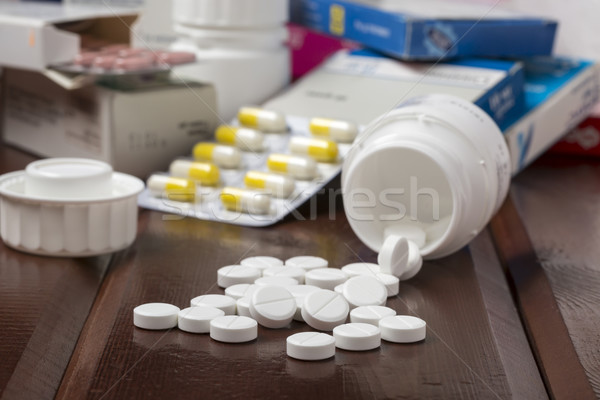 White pills and pill bottles Stock photo © ironstealth