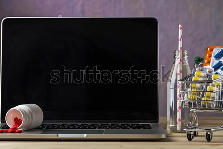Scattered pills on the laptop keyboard Stock photo © ironstealth