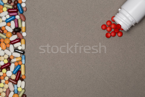 Blank page with border of colorful pills Stock photo © ironstealth
