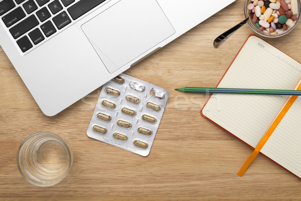 Close up antivirus set with pills blister pack and laptop Stock photo © ironstealth