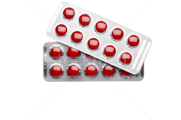 Two blister pack of red pills isolated on white background Stock photo © ironstealth