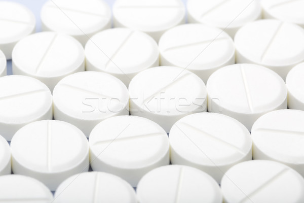 White pills on a white background Stock photo © ironstealth