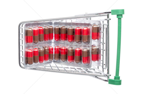 Shop cart with red-brown pills blisters  Stock photo © ironstealth