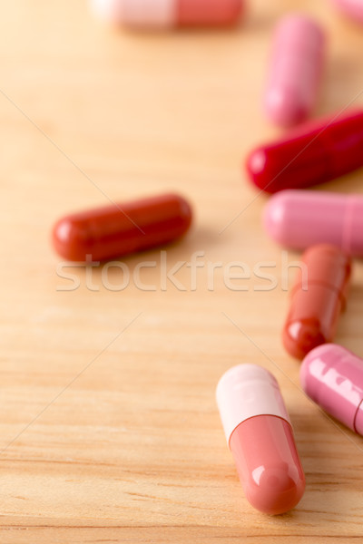 Scattered capsules of red and brown color Stock photo © ironstealth