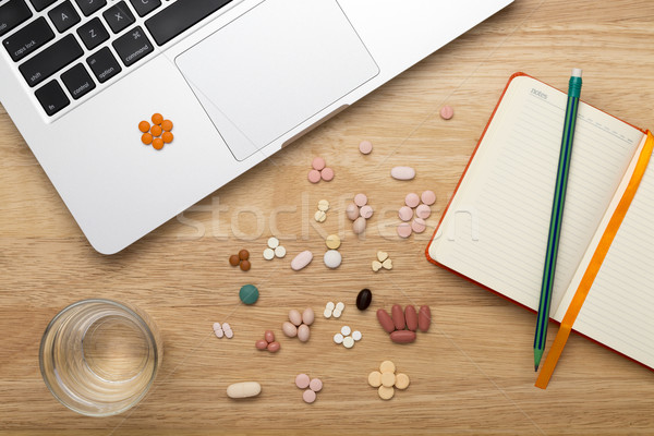 Laptop pc and colorfull pills Stock photo © ironstealth