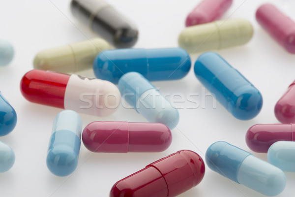 Colorful medicine capsules on white background Stock photo © ironstealth