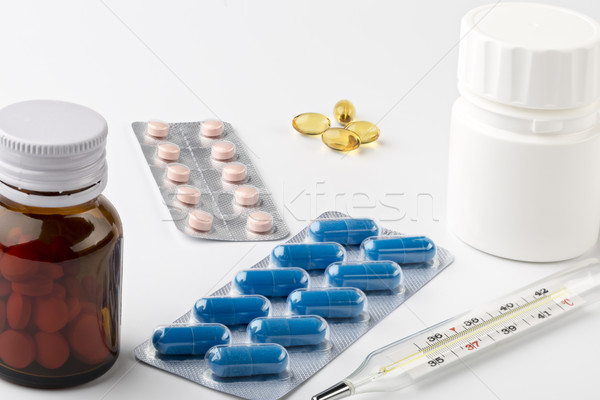 The treatment at home. Various blister pack and pills bottles Stock photo © ironstealth